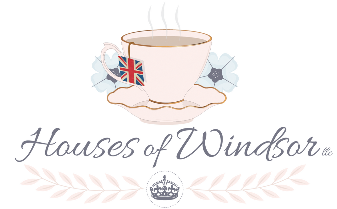 Houses of Windsor Logo a pink teacup and saucer with a teabag label hanging out of the cup in the style of the Union Jack flag. The words Houses of Windsor are under the saucer, with a British crown under the words, both in a gray color.
