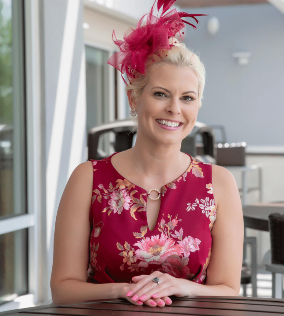 Lady Amy wearing a Red dress and red fascinator